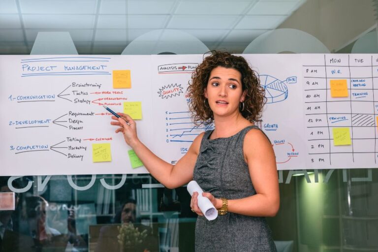 An Asian woman is presenting her ideas